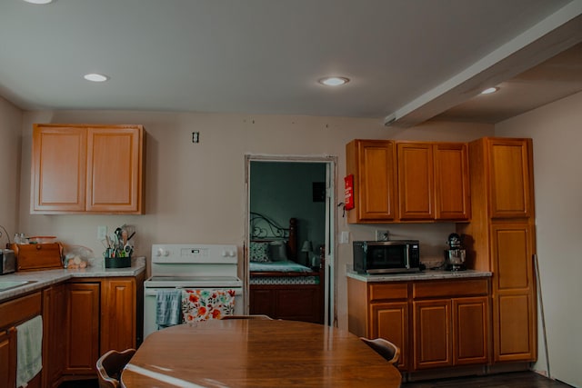 kitchen featuring beam ceiling, electric stove, and dark wood-type flooring