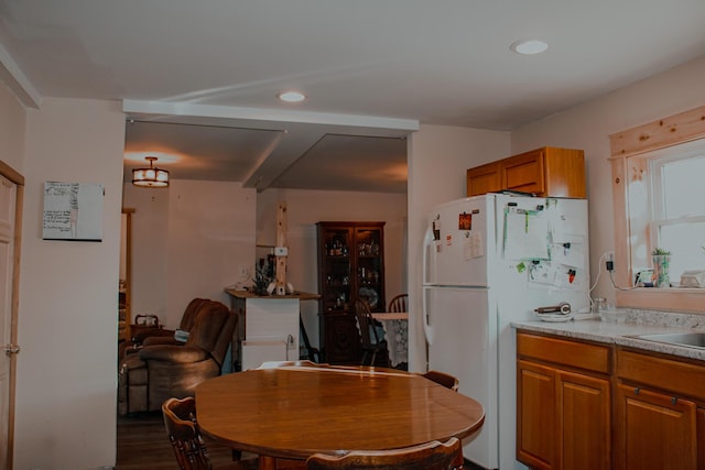 24 Elm St, Houlton, ME 04730 - kitchen featuring freestanding refrigerator, brown cabinetry, recessed lighting, dark wood finished floors, and light countertops