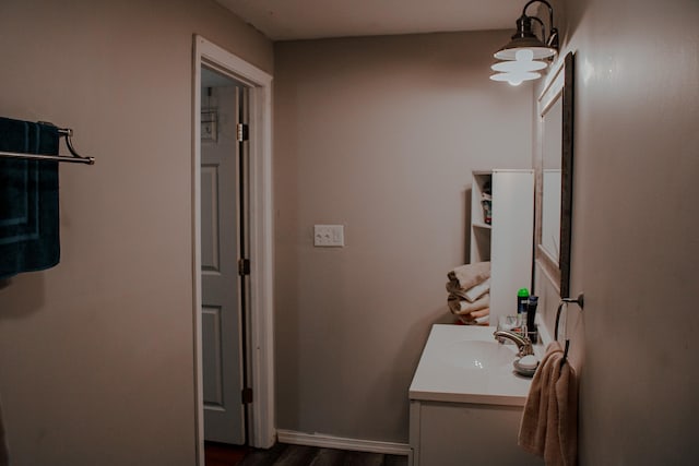 bathroom featuring wood-type flooring and vanity