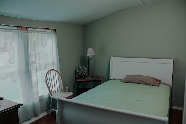 24 Elm St, Houlton, ME 04730 - bedroom with dark wood-style floors and lofted ceiling