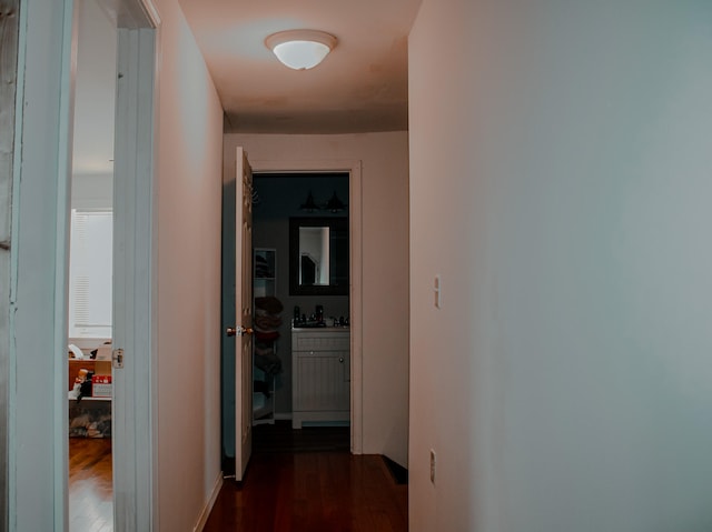 corridor featuring dark hardwood / wood-style flooring