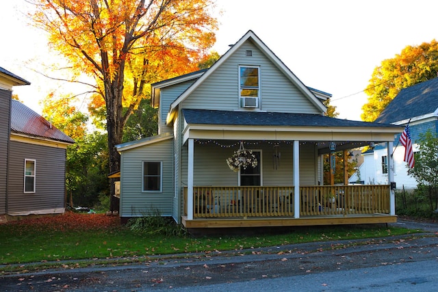 24 Elm St, Houlton, ME 04730 - view of front of property with a porch, roof with shingles, and cooling unit