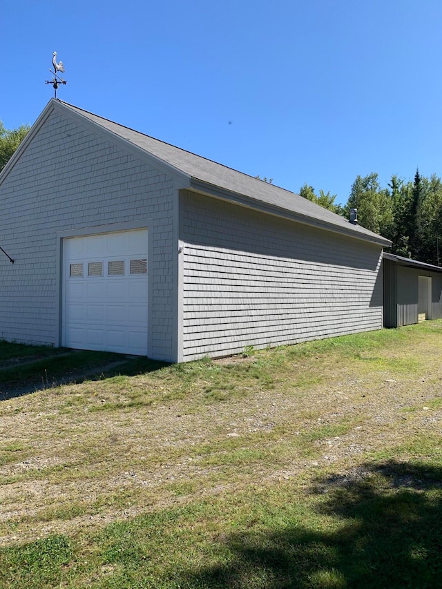 garage with a lawn