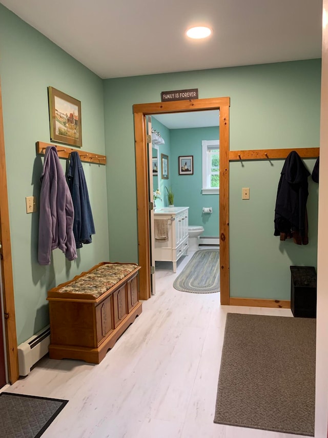 mudroom featuring light hardwood / wood-style flooring and a baseboard radiator