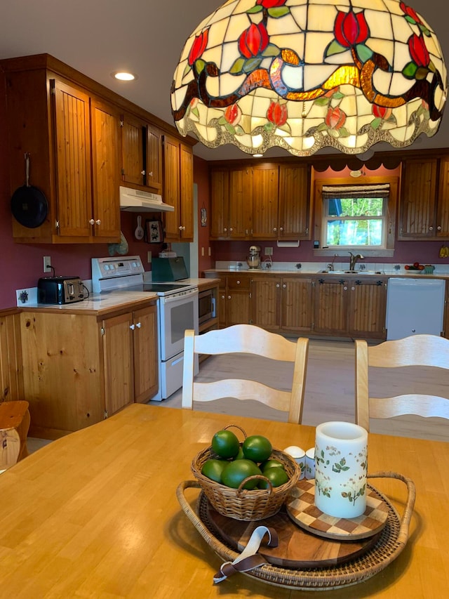 kitchen with white appliances and sink