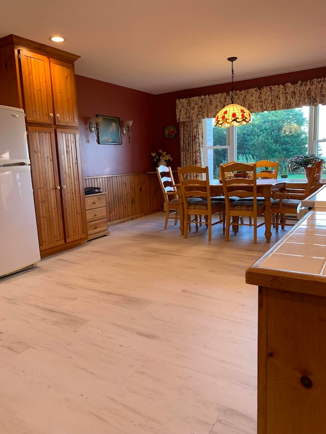 dining space featuring light hardwood / wood-style flooring