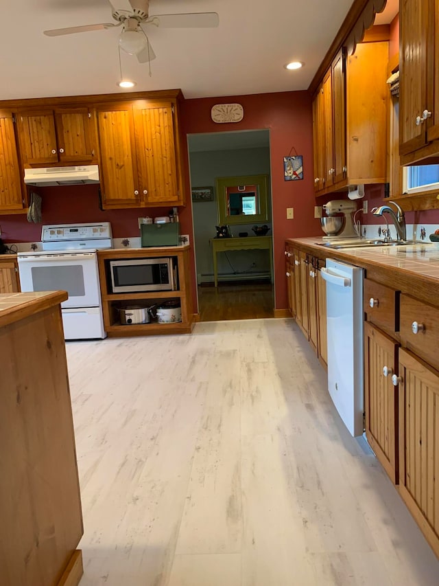 kitchen with ceiling fan, dishwasher, electric stove, stainless steel microwave, and light hardwood / wood-style floors