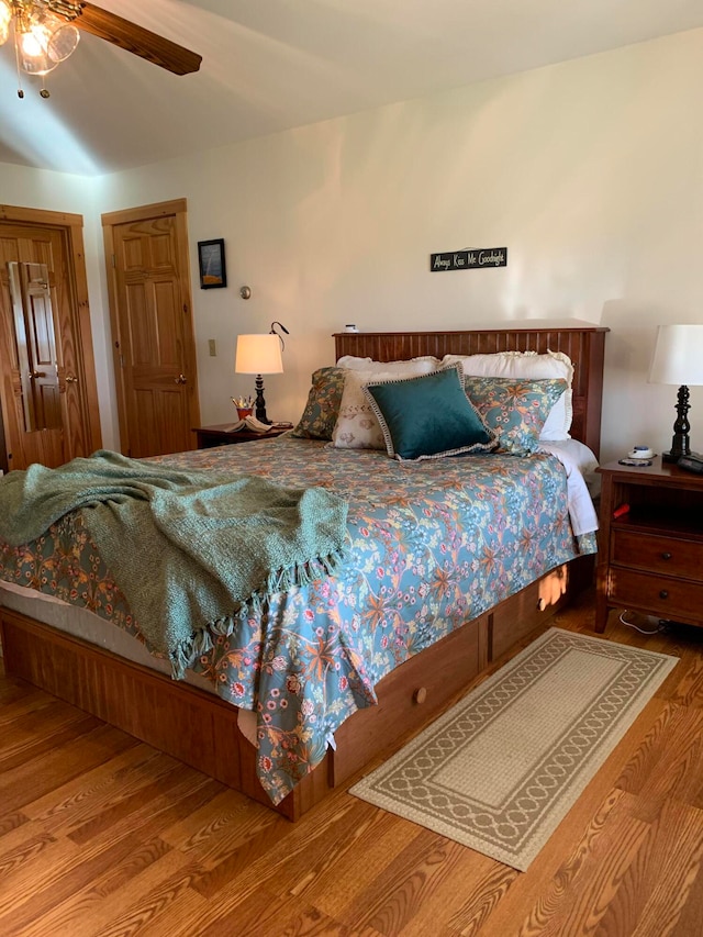 bedroom with ceiling fan and hardwood / wood-style flooring