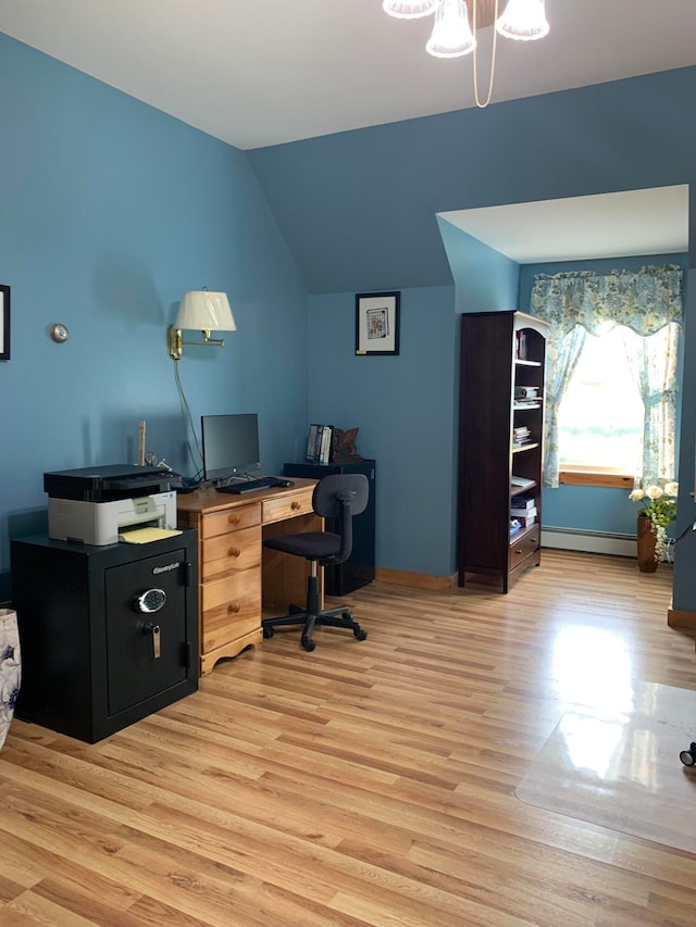 office area featuring light wood-type flooring, vaulted ceiling, a notable chandelier, and a baseboard radiator