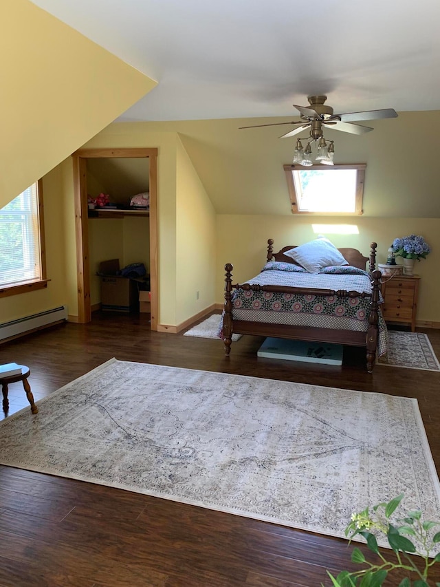 bedroom featuring ceiling fan, hardwood / wood-style flooring, and a baseboard radiator