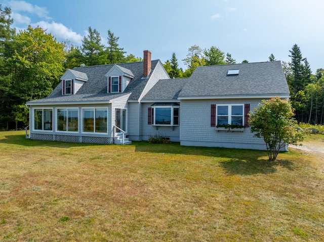 back of house with a yard