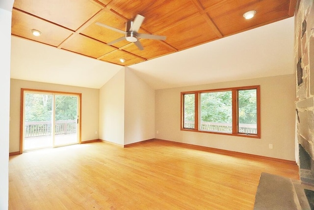 unfurnished living room with a wealth of natural light, a fireplace, and light hardwood / wood-style floors