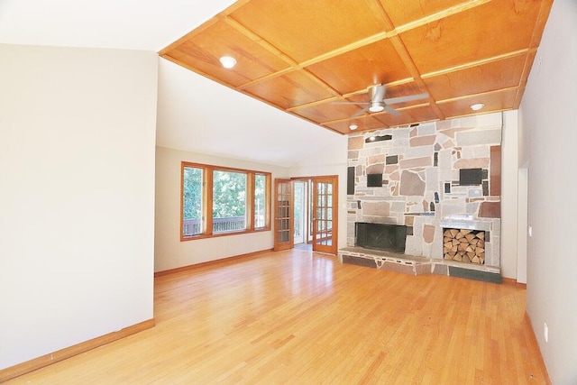 unfurnished living room featuring a stone fireplace, ceiling fan, wooden ceiling, lofted ceiling, and hardwood / wood-style flooring