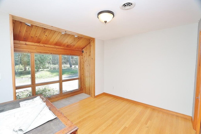 interior space featuring vaulted ceiling, hardwood / wood-style flooring, and wooden ceiling