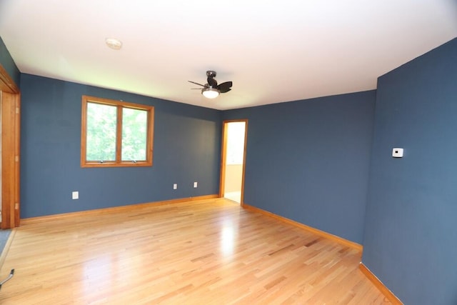 empty room featuring ceiling fan and light wood-type flooring