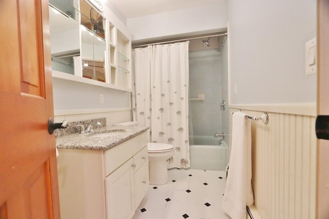 full bathroom featuring toilet, vanity, and shower / tub combo