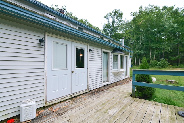 wooden terrace with a yard