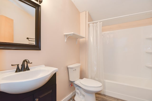 full bathroom featuring vanity, toilet, wood-type flooring, and shower / tub combo with curtain