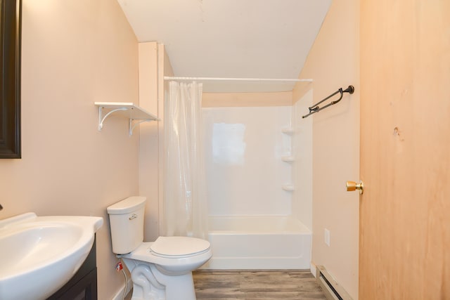 full bathroom featuring toilet, vanity, shower / bath combination with curtain, a baseboard heating unit, and hardwood / wood-style flooring