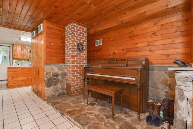 interior space featuring wooden ceiling, wood walls, and light tile patterned flooring