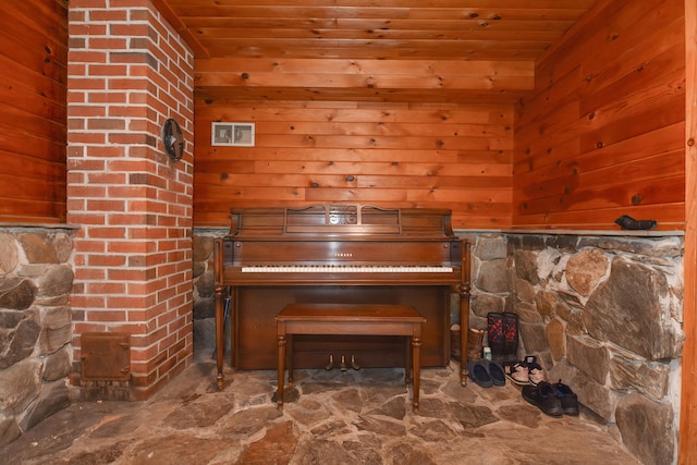 interior space with wood walls and wood ceiling