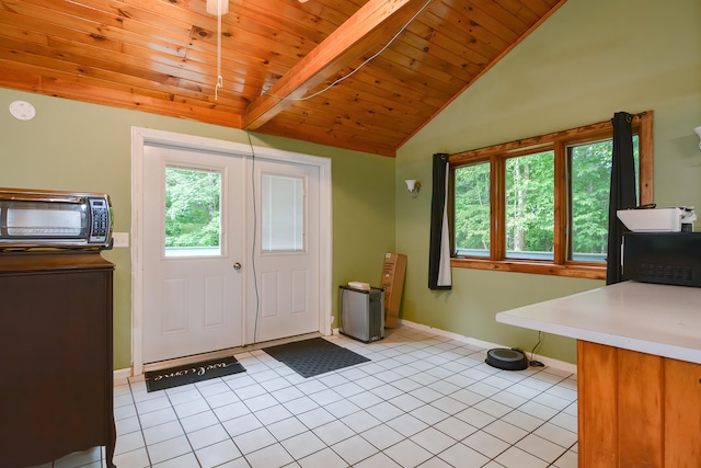 entrance foyer featuring wood ceiling, vaulted ceiling with beams, and light tile patterned flooring