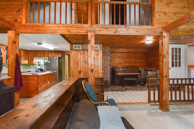 tiled living room with wooden walls