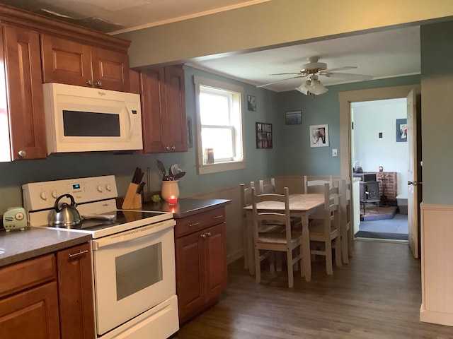 kitchen featuring ceiling fan, white appliances, and dark hardwood / wood-style flooring