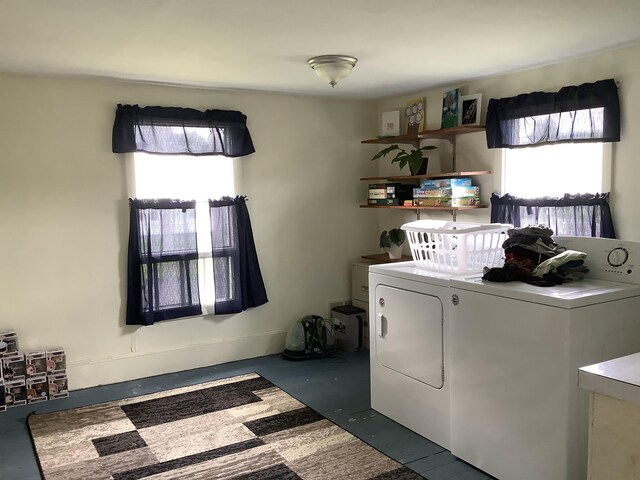 laundry area with washing machine and clothes dryer