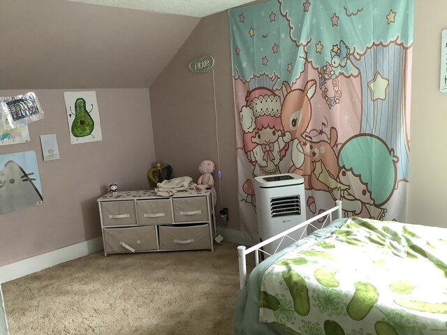 bedroom with lofted ceiling and carpet flooring