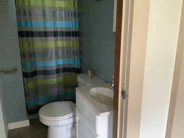 bathroom with vanity, toilet, and walk in shower