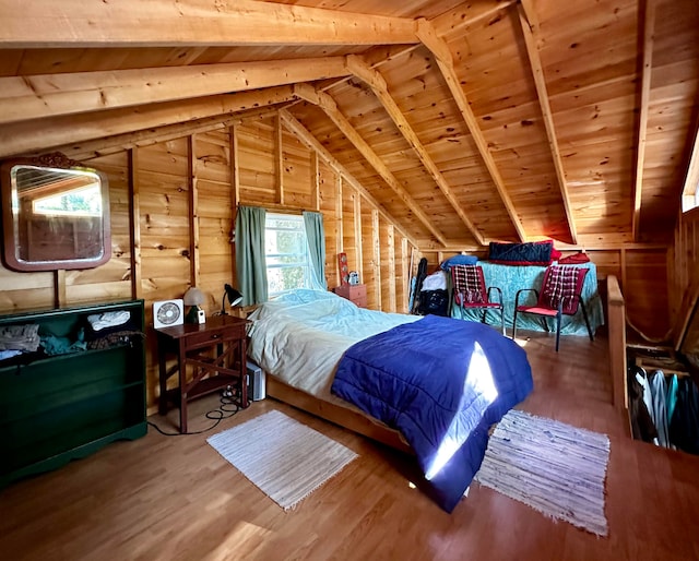 bedroom featuring wooden walls, wood-type flooring, and lofted ceiling with beams