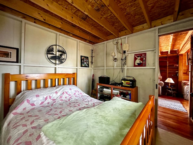 bedroom with hardwood / wood-style flooring