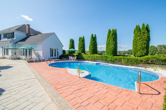 view of swimming pool featuring a patio