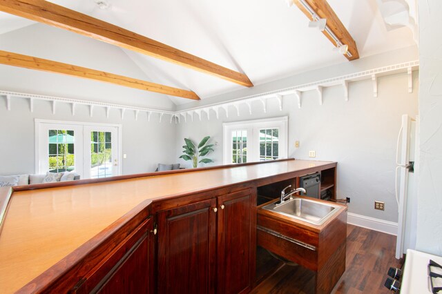 kitchen with a wealth of natural light, french doors, and lofted ceiling with beams