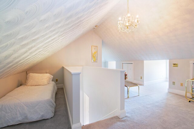 carpeted bedroom with lofted ceiling and a chandelier