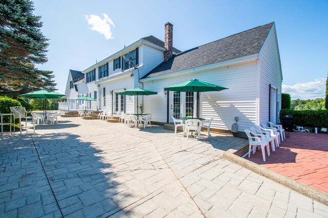 back of property featuring a patio area