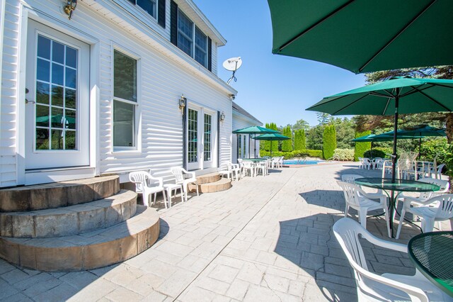 view of patio / terrace featuring a pool