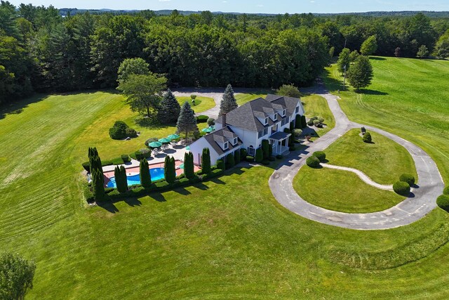 birds eye view of property with a rural view