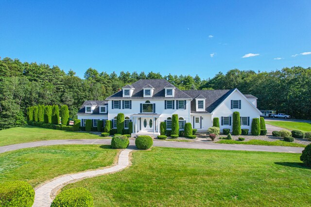 colonial home with a front yard