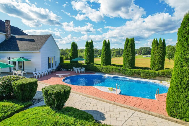 view of pool featuring a patio area