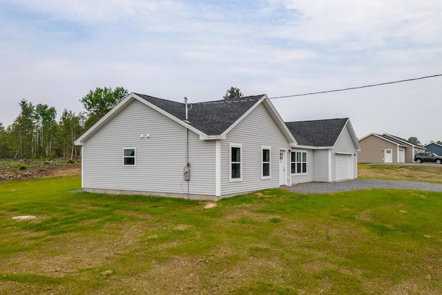268 Merrill Rd, Levant, ME 04456 - view of front of home featuring a garage, driveway, a shingled roof, and a front yard