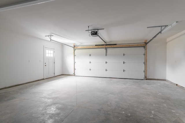 268 Merrill Rd, Levant, ME 04456 - garage featuring a garage door opener and baseboards