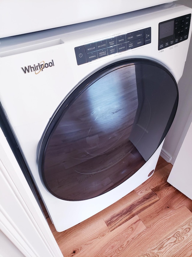 interior space with wood-type flooring and washer / clothes dryer