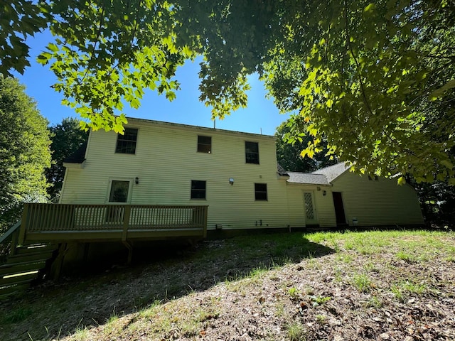 rear view of property with a wooden deck