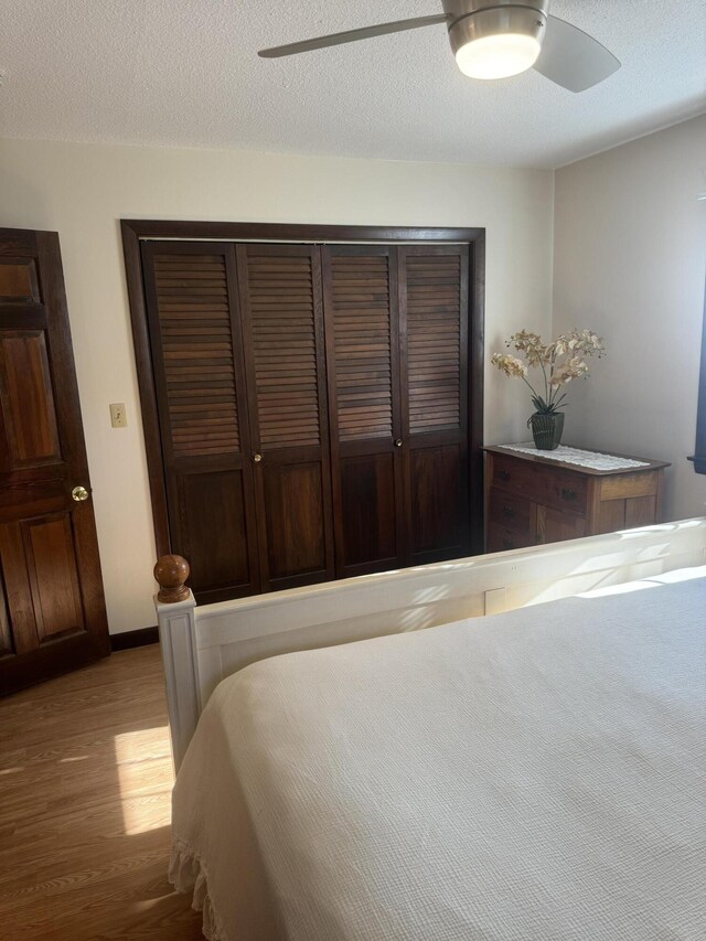 265 Main Rd, Bradford, ME 04410 - bedroom featuring baseboards, ceiling fan, wood finished floors, a textured ceiling, and a closet