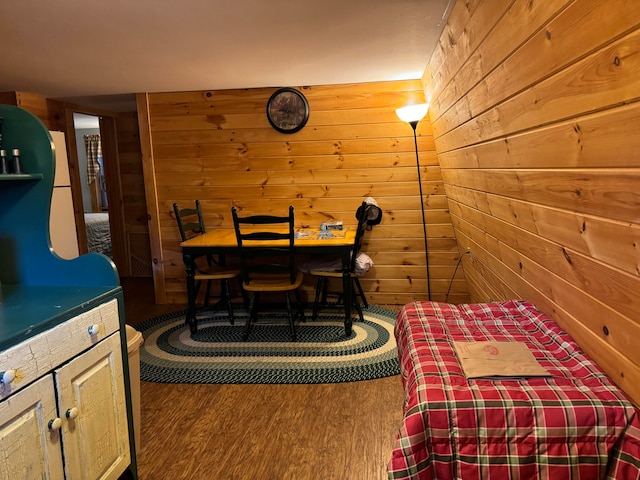 interior space featuring wood walls and hardwood / wood-style floors