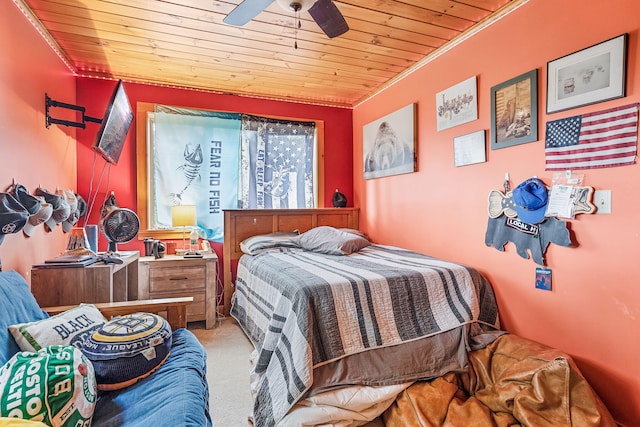 bedroom featuring light carpet, wood ceiling, crown molding, and ceiling fan