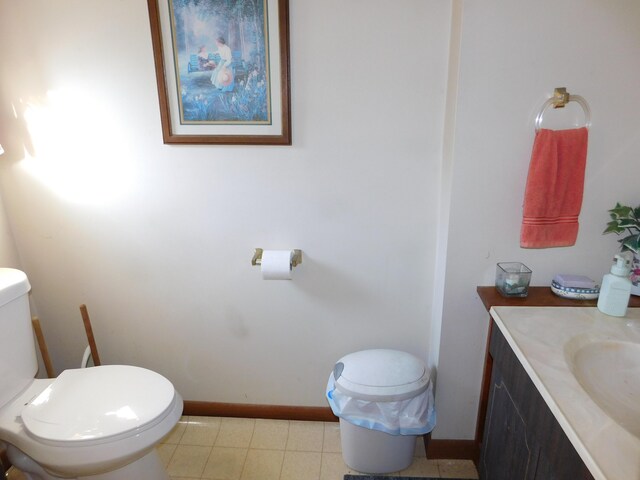 bathroom with toilet and vanity