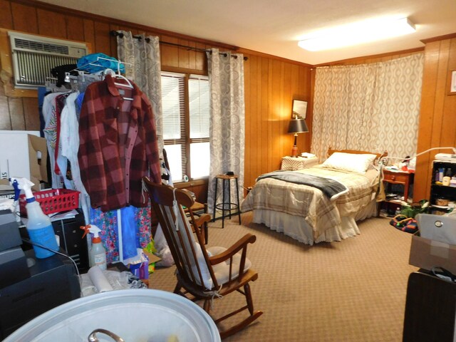 carpeted bedroom featuring wood walls, a wall unit AC, and ornamental molding